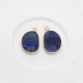 Detail of natural Lapis Lazuli stone charms with irregular gold-plated edging - Dark Blue