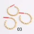 Detail of matte gold twisted geometric circle earrings with textured alloy finish - Retro Twisted(03)