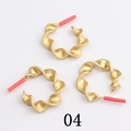 Detailed view of matte gold C-shaped geometric chain link earring components with red tips - Matte Gold Twisted(04)