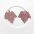 Detailed view of matte red maple leaf hollow copper pendants for DIY earring jewelry making - Pink