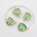 Detail view of 13x18mm green heart crystal pendants with gold frames and double loops - Fruit Green