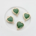 Close-up of green faceted heart charms with gold-plated edges and double connector rings - Green Jade