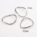 Detailed view of irregular zinc alloy rings with 25mm and 32mm inner diameter dimensions - Large / Silver
