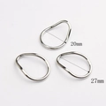 Detailed view of irregular zinc alloy geometric rings with 20mm and 27mm inner diameters - Small / Silver
