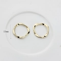 Detail view of 15mm golden irregular wavy textured round metal pendants for DIY jewelry - 15mm / Gold