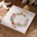 Buntes Edelstein-Perlenarmband mit Muscheln und goldenem Seestern-Anhänger - Mehrfarbig