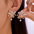 Elegant gold flower earrings with pavé crystals and faux pearls worn on the ear - Gold Branch Pearl Rhinestone (ER24Y0249-2)
