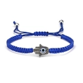 Adjustable blue braided rope bracelet with silver Hamsa Hand and Evil Eye charm - Hamsa Hand Blue Rope