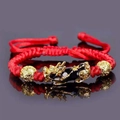 Handcrafted red braided Pi Xiu bracelet with gold beads on a reflective dark surface - Red Rope Single Gold PiXiu