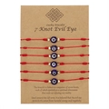 Set of 6 red braided 7-knot bracelets featuring blue evil eye beads on a brown card - Red