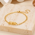 Gold Leo zodiac charm bracelet with Figaro chain and lobster clasp on stone base - Gold Leo