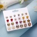 Detailed view of 12 pairs of small floral and heart stud earrings on a paper display card - Flower Star Pearl Zirconia Gold Red Set (ER23Y0816-5)