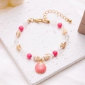 Detail of beach shell bracelet with pink scallop charm and small conch on white stone - Shell Conch Beaded Bracelet (Pink)