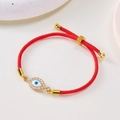 Verstellbares rotes Kordelarmband mit blauem Auge-Anhänger und goldenen Details - Rotes Seil-Zirkonia Auge(BR24Y0217)