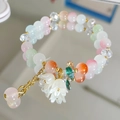 Pastel beaded bracelet with white lily of the valley charms and gold chain detail - Colorful Lily