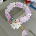 Double-layered beaded bracelet featuring purple crystals and white lily of the valley charms - Purple Lily