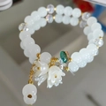 Beaded double-layer bracelet with white lily of the valley flower and green crystal - White Lily