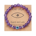 Macro detail of 8mm purple bead bracelet with Evil Eye charm on a gift display card - Purple Glass Beads (BR24Y0308-4)