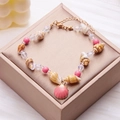 Pink shell anklet with natural conch beads and gold scalloped pendant on jewelry box - Pink Scallop (AK24Y0018-5)