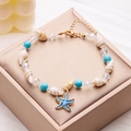 Beaded seashell anklet with blue starfish pendant on a champagne jewelry box - Blue Starfish (AK24Y0018-7)
