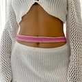 Close-up of pink and white multi-layer beaded waist chains for a boho beach look - Pink