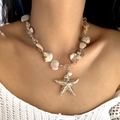 Close-up of bohemian necklace with golden starfish charm and iridescent shell fragments - Shell Slice Starfish Pearl Necklace Style (NC25Y0356-4)