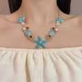 Hawaïaanse ketting met blauwe zeesterren, schelpen en parels voor een zomerse strandlook - Blauwe Zeester Ketting