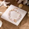 Seestern Armband mit rosa Natursteinen und Perlen für den sommerlichen Strand-Look - Armband-Rosa