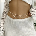 Detailed view of bohemian double-layer waist chain with white beads and shell pendants - White Artificial Pearl Style