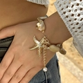 Baroque pearl bracelet with gold starfish charm and extension chain for a vacation look - Gold Starfish Irregular Pearl Bracelet Style (NC25Y0356-Bracelet-Gold)