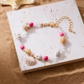 Böhmisches Strandarmband mit natürlichen Muscheln, rosa Perlen und Goldmuschel-Anhänger - Rosa Strass Muschel