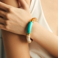 Bohemian resin marble bead bracelet with amber and teal tube beads on a model's wrist - Multicolor Mix (AB0008-6)