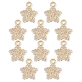 Detalle de diez colgantes de estrella dorados en aleación con pedrería blanca para el DIY - Estilo Estrella de Cinco Puntas (px1106-7)