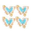 Vue détaillée de quatre breloques papillon en alliage émaillé bleu clair avec dorure - Dégradé Bleu et Blanc Cadre Doré (px1172-5)