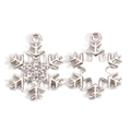 Detailed view of silver snowflake charms with rhinestones and hollow metal patterns - White Gold Rhinestone Hollow Contrast Style (px1195-7)