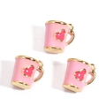 Detailed view of pink coffee mug charms with red hearts for DIY jewelry making - Pink