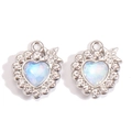 Macro detail of Y2K heart moon pendants with iridescent crystals and alloy metal - Starry Heart Style (px1207-6)
