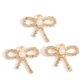 Detailed view of three golden bow pendants with micro-pave crystals and center pearls - Pearl Bow Style (px1229-5)