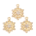 Macro shot of three golden snowflake pendants with sparkling crystals for DIY jewelry making - Gold Snowflake Style (px1229-8)