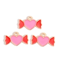 Close-up of heart-shaped candy charms with pink enamel and red wings for DIY jewelry - Heart Candy Shape (px1244-6)