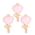 Close-up of pink enamel heart lollipop charms with gold bow details for DIY jewelry - Pink Heart Lollipop Style (px1244-11)