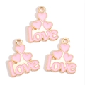 Close-up of pink enamel heart pendants with gold love lettering for DIY jewelry - Pink Layered Heart love Letter Style (px1244-17)