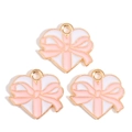 Detail of three heart charms with pink bows and gold alloy edges for DIY jewelry making - Pink Bowknot Heart Style (px1244-21)
