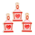 Detailed macro view of three gold-plated cartoon house charms with red and pink enamel hearts - Heart Cartoon House Style (px1244-25)