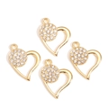 Close-up of four gold hollow heart pendants with inlaid white rhinestones for DIY jewelry - Golden Hollow Rhinestone Heart Style (px1255-6)