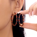 Detailed view of large twisted hoop earrings with red and black enamel spiral stripes - Red And Black Spiral Twisted Style (ER25Y0269-8)