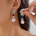 Detailed close-up of Christmas snowman earrings with sparkling snowflakes on model ear - Snowflake Stud Style (ER25Y0286-1)