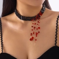 Close-up of Gothic black beaded choker with layered red tassel drops for Halloween - Three-layer Black Red Beaded Tassel Style / Red Crystal