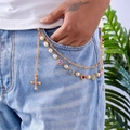 Detail of multi-layer gold pants chain with colorful heart gems, pearls and cross pendant - Gold Cross Heart Style