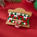 Weihnachts-Armbandset mit Perlen und Anhängern auf festlichem rotem Hintergrund - Rot Weiß Grün Mit Weihnachtsmütze Zuckerstangen Stil (#1)